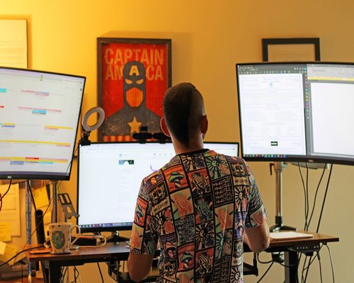 A person managing screen time comfortably at a home office desk